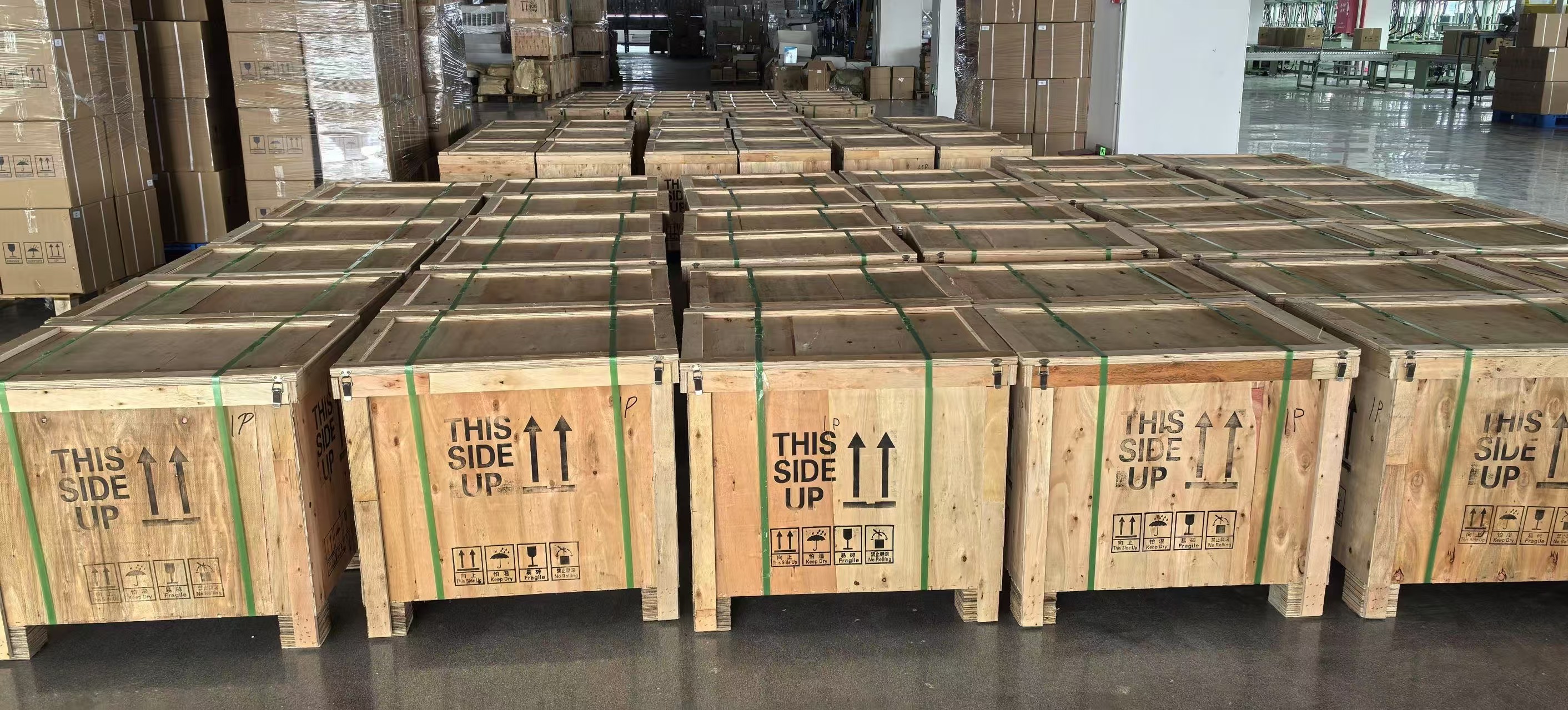 Strapped wooden shipping cases with upright and handling symbols